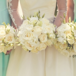 Bride with bridesmaids holding wedding bouquets